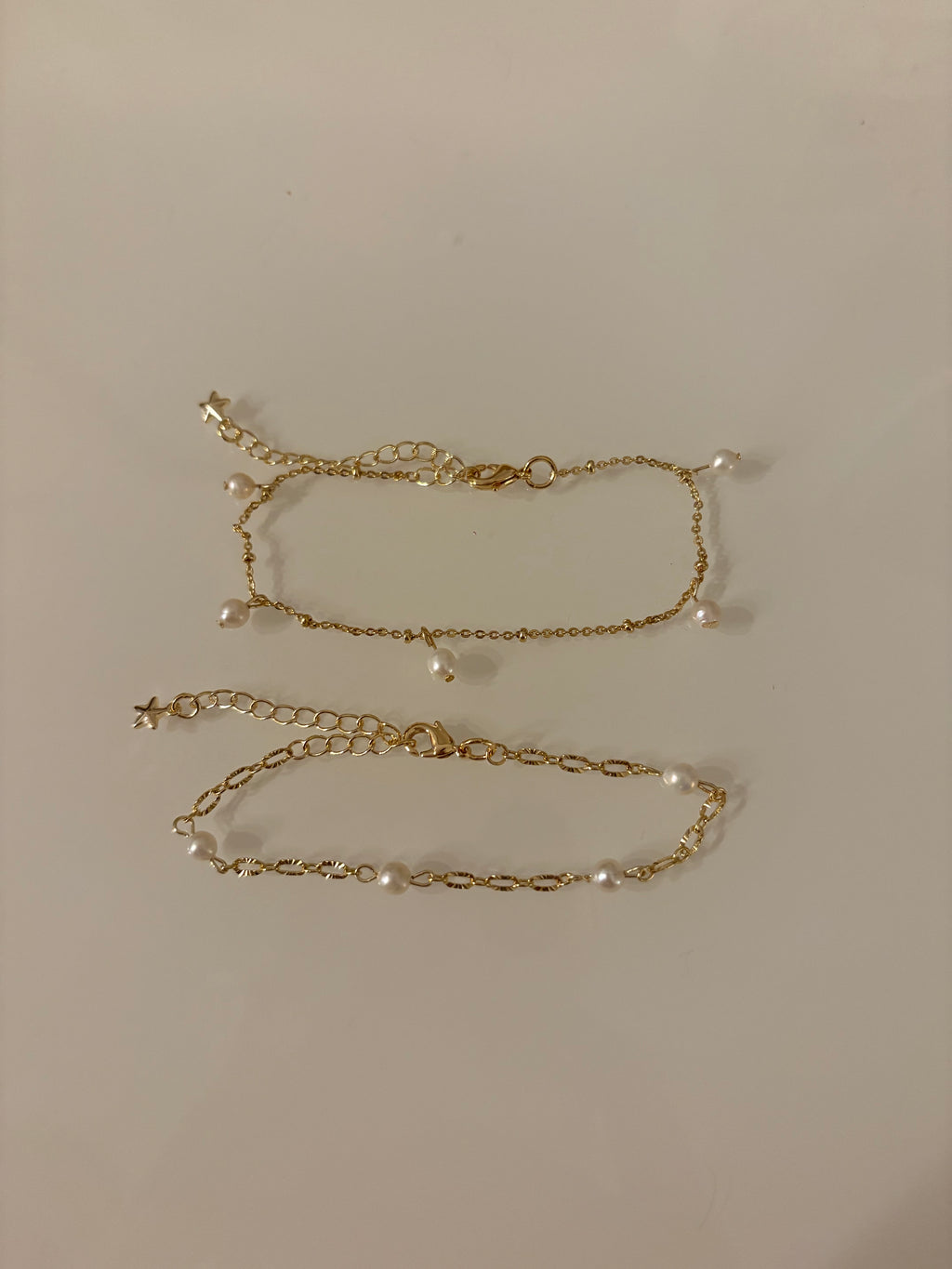 Gold chain necklace on a plain background