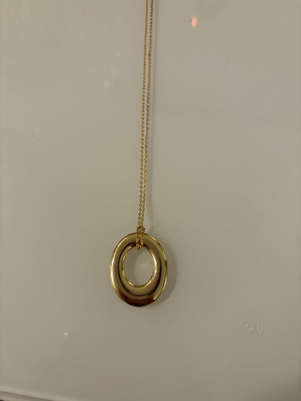 Gold filled open circle pendant with chain connecting